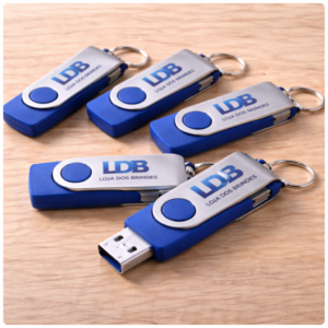 Branded USB drives on wood surface