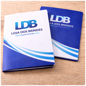 Branded presentation folders on wooden surface